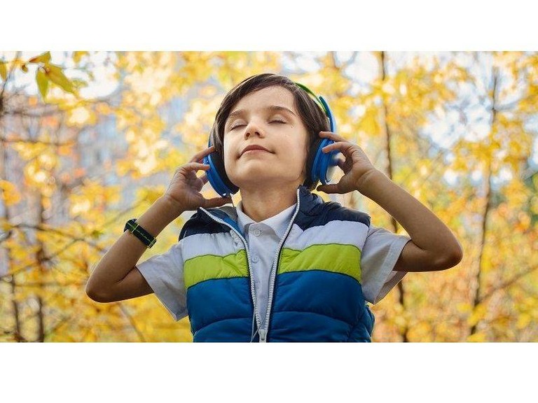 Boy listening to headphones