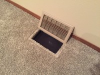 in-floor subwoofer vent open