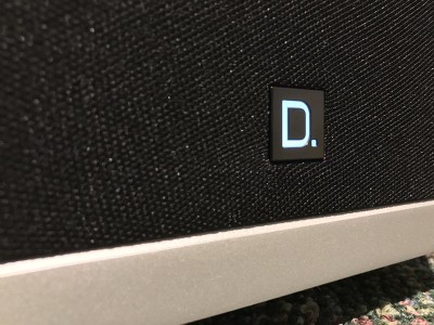 Definitive technology glowing D on each speaker